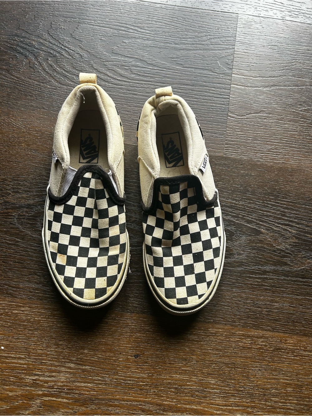 Vans Kids Checkerboard Slip-On Sneakers in Black and Cream